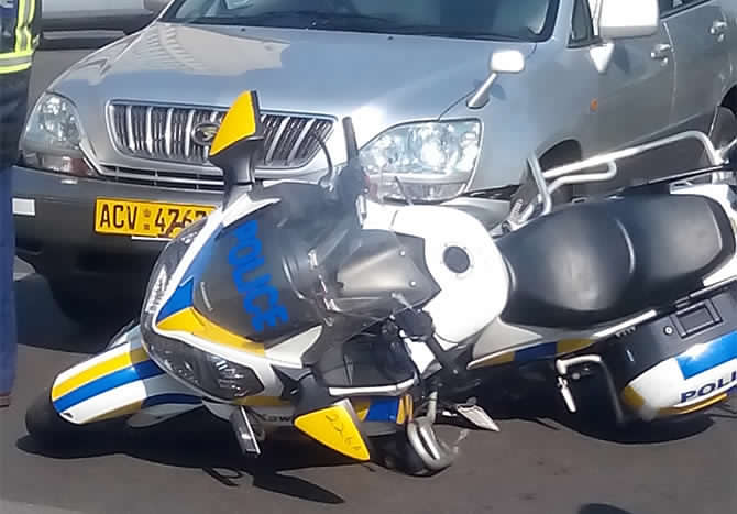 Mugabe's biker in horrific accident